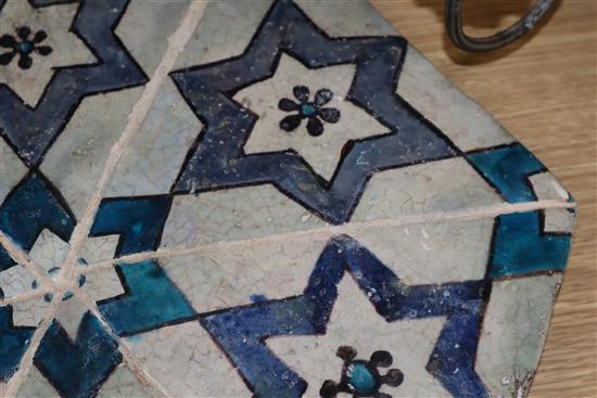 An Islamic hexagonal tile, 43cm sq.